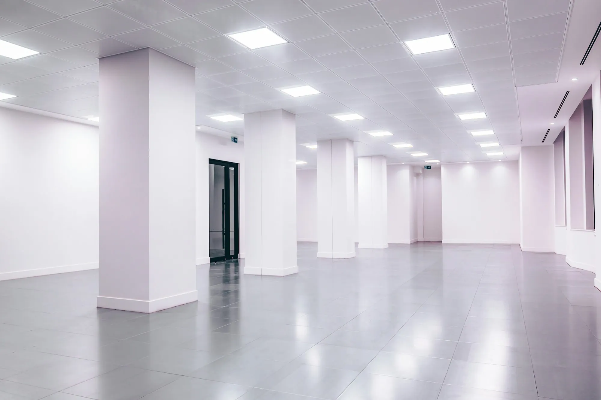 Empty office with bright lights and a glossy floor